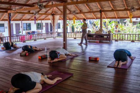 Yoga instructor teaching class